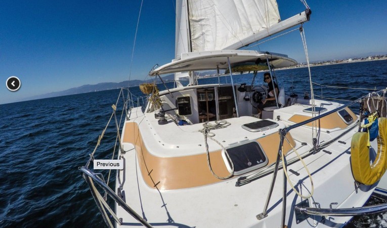 32 PDQ Large center cockpit with convenient dinghy davits aft.