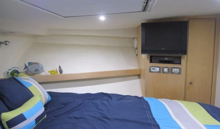60 Bertram VIP Stateroom TV and Starboard Closet