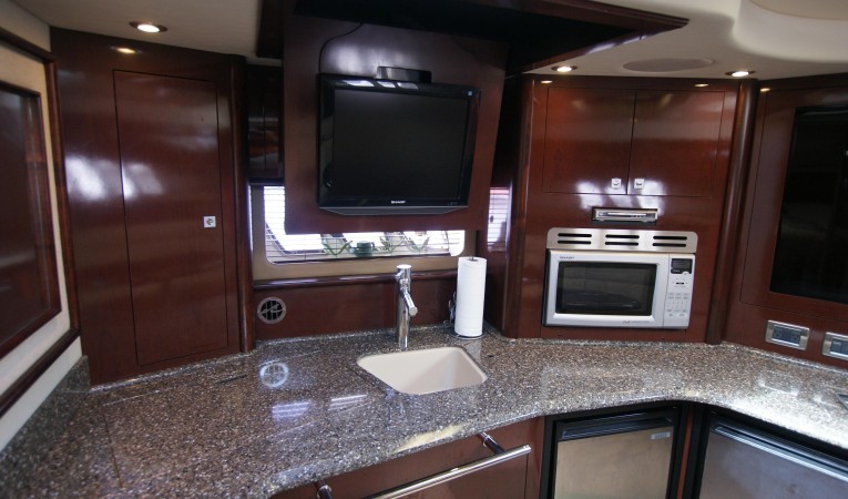 44 Sea Ray salon TV in overhead compartment