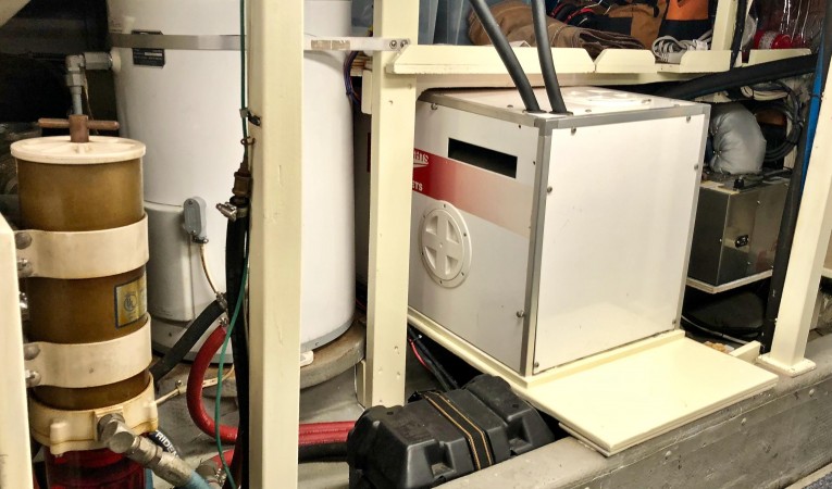 53 Tollycraft Starb. Side of Aft Engine Room: Small Generator, Hot Water Tank & Storage