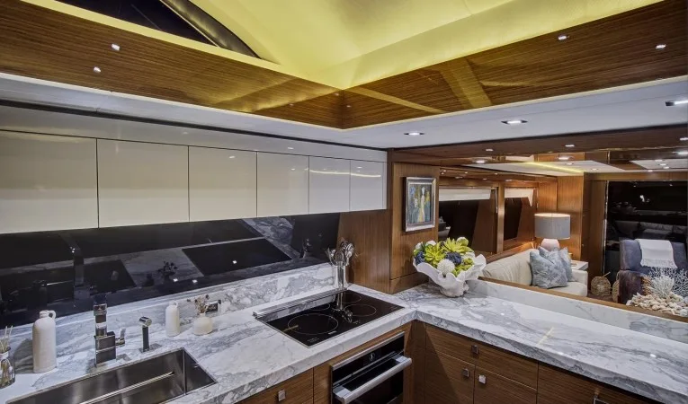 75 Hatteras Open galley to salon